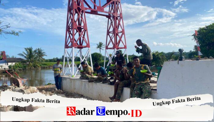 Dari Semangkuk Bubur Asyura, Kebersamaan Personel Kodim 1009/Tanah Laut dan Warga Handil Labuan Amas Kian Kompak