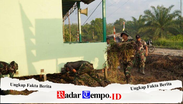 Satgas TMMD Ke-129 Bersihkan Halaman Poskamling Demi Menjaga Kerapian