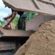 Turunkan Material Pasir, Satgas TMMD Reguler Ke-129 Gunakan Sekop